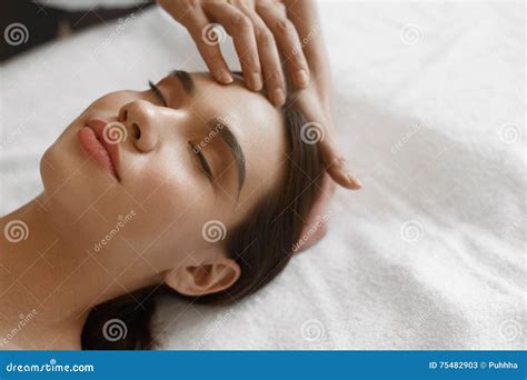 Spa Massage Beautiful Woman Getting Facial Beauty Treatment Stock