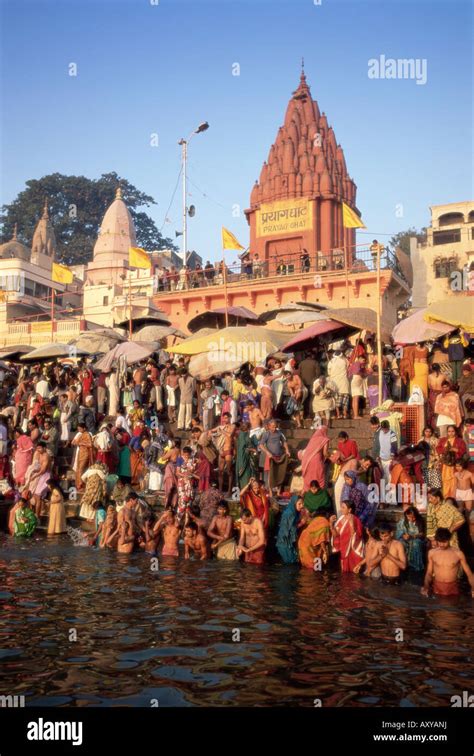 Hindus bathing in the early morning in the holy river Ganges along ...