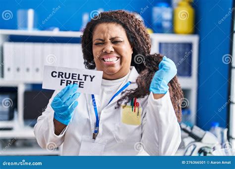 Plus Size Hispanic Woman Working On Cruelty Free Laboratory Screaming