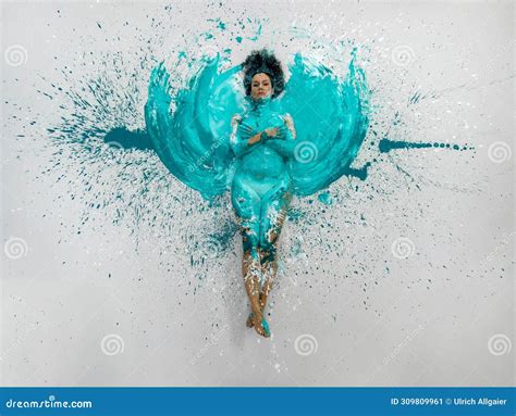 Expressive Woman Lies Naked Elegant On The Floor In Turquoise Blue