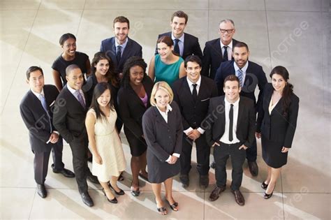 Portrait Of Multi Cultural Office Staff Standing In Lobby Background