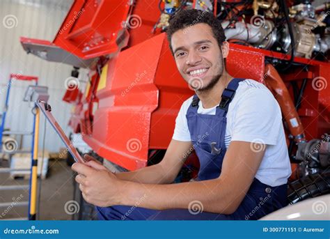 Factory Worker Operating Machine Units At Modern Factory Stock Image