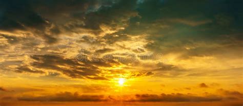 Panorama Cloudy Sky And Sun At Golden Hour Background Stock Photo