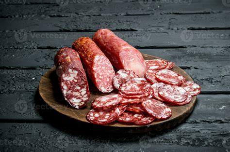 Different types of salami on the Board. 32010513 Stock Photo at Vecteezy