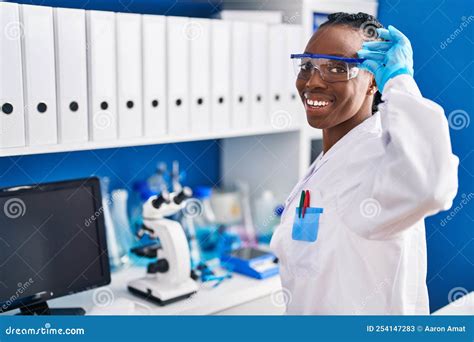 African American Woman Scientist Smiling Confident At Laboratory Stock