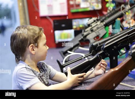 Child With Rifle At A Shooting Range Stock Photo Alamy