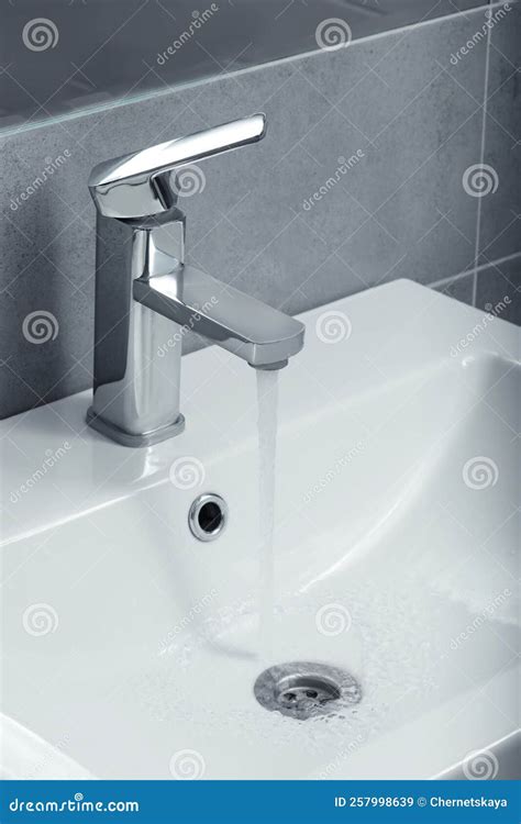 Stream Of Water Flowing From Tap In Bathroom Stock Image Image Of