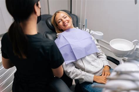 Premium Photo Portrait Of Positive Blonde Female Patient With Dental Problem Talking With