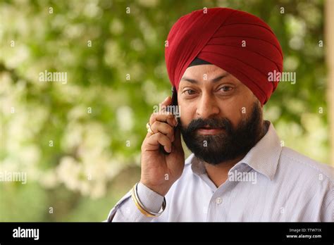 Indian Sikh Man Talking On A Mobile Phone Stock Photo Alamy