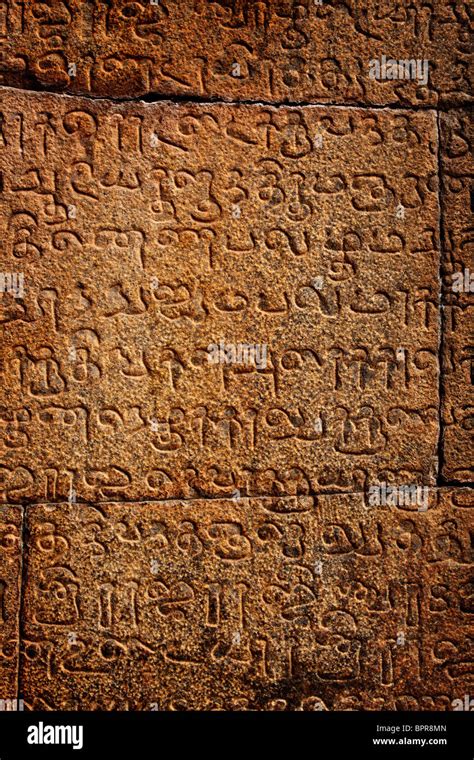 Ancient inscriptions on stone wall in Tamil language Stock Photo - Alamy