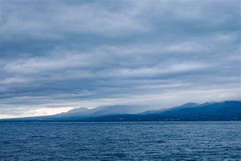 Free Photo Island Across Body Of Water Under Cloudy Sky Clouds