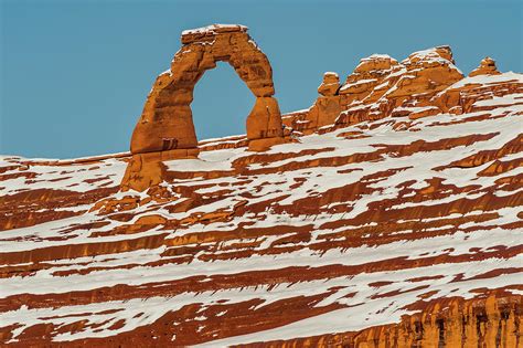 Delicate Arch In Winter Photograph by Jeff Foott - Fine Art America