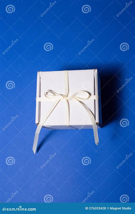 A Beautiful, White Gift Box with a White Bow on a Beautiful Background ...