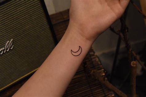 Minimalistic Crescent Moon Tattoo Located On The Wrist