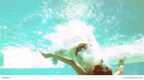 Brunette Diving Underwater In Swimming Pool Stock Video Footage 4469405