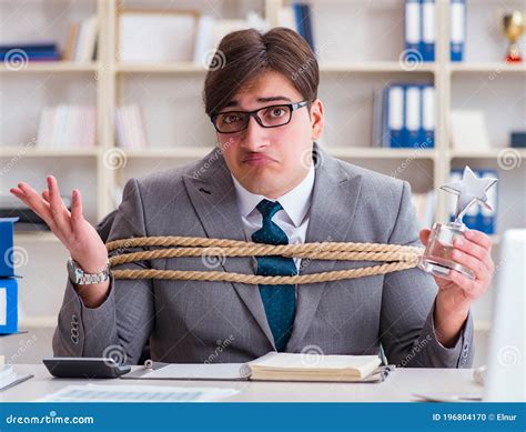 The Businessman Tied Up With Rope In Office Stock Photo Image Of