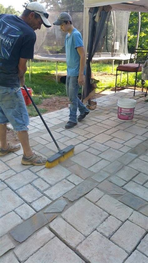 This Image Shows A Quikrete Fan Putting The Finishing Touches On Their