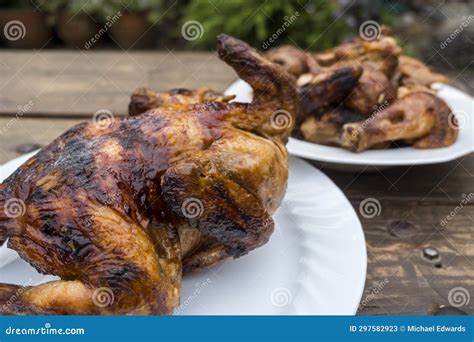 Lechon Manok Or Roasted Chicken Served Both Whole And Chopped Outside