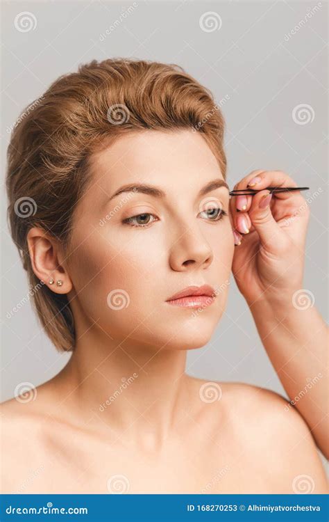 Eyebrow Correction With Tweezers Blonde Model Face With Makeup Nude