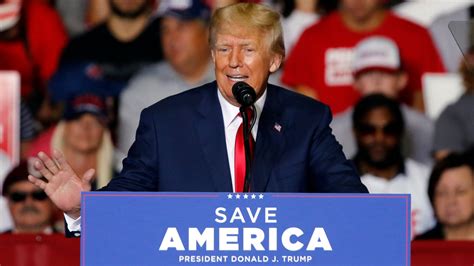 Is Trump Embracing Qanon Ohio Rally Salute Signals Ties To Movement