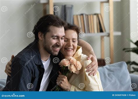 Grateful Happy Mature Mom Embracing Grown Son Man With Gratitude Stock