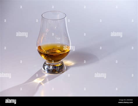 Tulip Shaped Tasting Glass With Dram Of Scotch Single Malt Or Blended