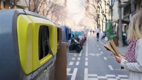 Woman Throwing And Sorting An Plastic And Paper Trash In The Recycling