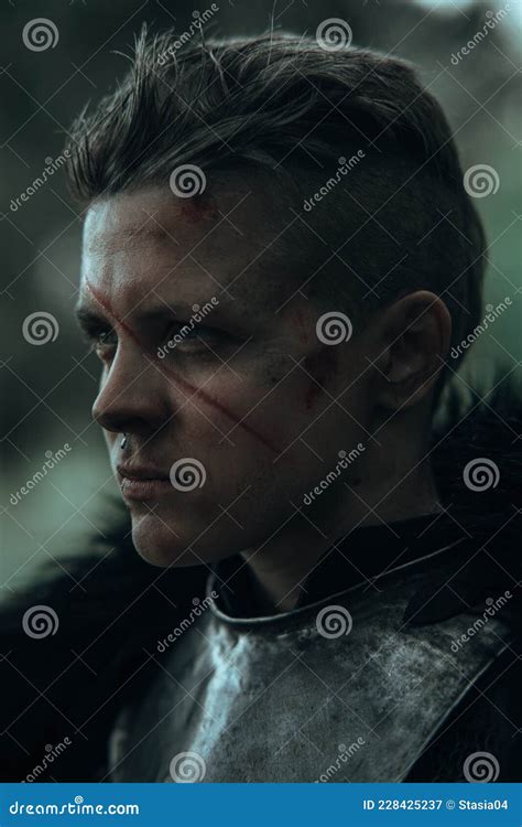 Portrait Of Medieval Knight In Armour With Face Scar Stock Image