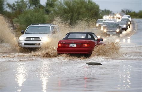 Photos Flooding Prompts Evacuations Closes Roads In Arizona Los