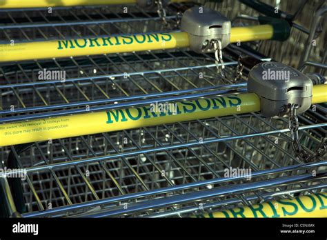 Morrisons Supermarket Trolleys In A Trolley Parking Bay Stock Photo Alamy