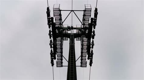 Ropeway Cable Car Cabins Silhouettes Are Moving Against Gray Sky In