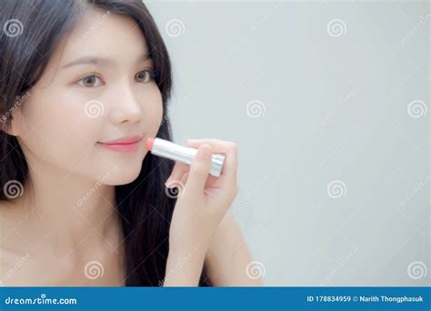 Beautiful Young Asian Woman Applying Lipstick Pink With Style Bright