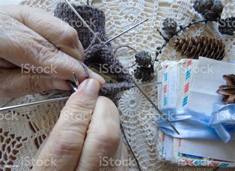 Hand Of A Old Woman Wrinkled Female Hands With Knitting Closeup Stock