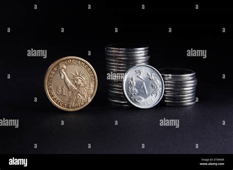 concept of Indian Rupee and American Dollar coins Stock Photo - Alamy