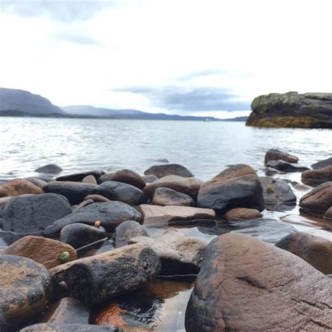 Rocks On The Shore Of A Body Of Water