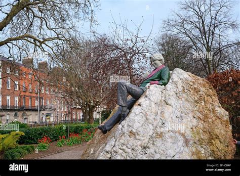 Memorial Statue Of Oscar Wilde By Danny Osborne Lounging On A Rock In