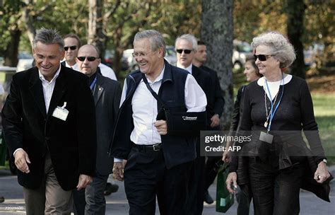 Us Defense Secretary Donald H Rumsfeld Walks With Matjaz Pust