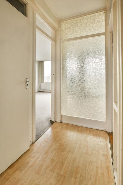 Premium Photo | A glass door in a room with a wood floor