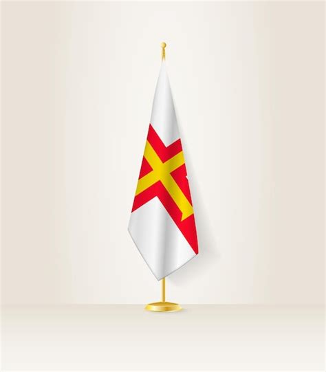 Premium Vector | Guernsey flag on a flag stand