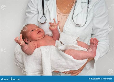 Pediatrician Doctor Is Holding Newborn Baby In Arms Stock Image Image