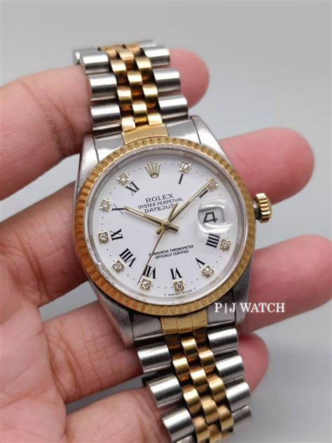 Rolex Datejust 36mm Steelandyellow Gold 18k White Roman Diamond Dial Ref16233