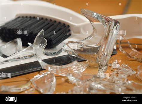 Remnants Pile Of Broken Glass On Floor After Accident And Glass Slipped Out Of Wet Hands Knocked