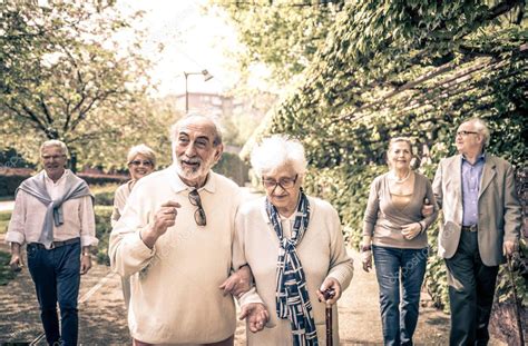 Smiling old people walking — Stock Photo © oneinchpunch #130704938