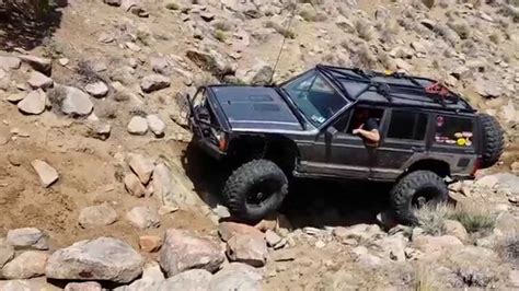 Cherokee Xj With An Exocage On 37 Super Swampers On Buster Youtube