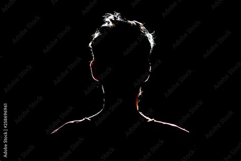 Silhouette Of Man In Dark Place Anonymous Backlit Contour A Stock