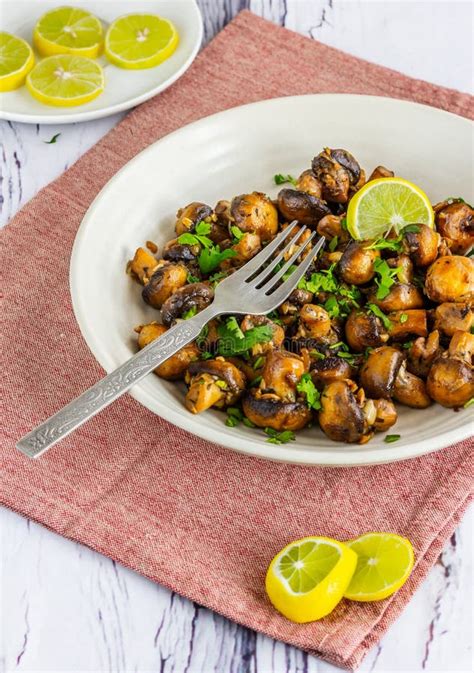 Broccoli And Mushroom Stir Fry With Cashew Nuts And Sesame Seeds Stock