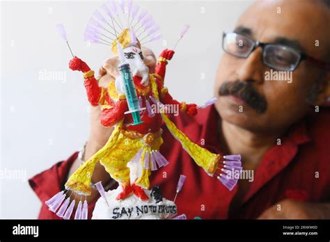 Samiran De, an artist works on an idol of Lord Ganesha made with soup ...