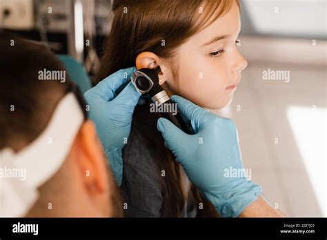 Close Up Examination Of Childs Ear With Otoscope Otoscopy Visit To