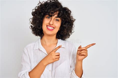 Young Arab Woman With Curly Hair Wearing Casual Shirt Over Isolated