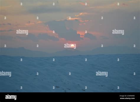 Sunset in White Sands with Sun Stock Photo - Alamy